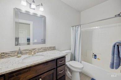 This stunning, custom-built home features both a primary and on Hunters Point Golf Club in Idaho - for sale on GolfHomes.com, golf home, golf lot