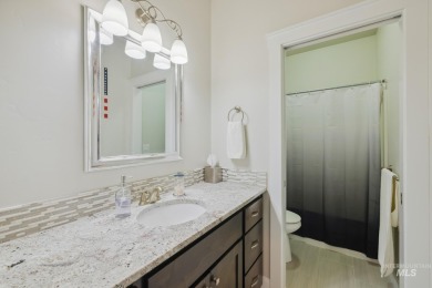 This stunning, custom-built home features both a primary and on Hunters Point Golf Club in Idaho - for sale on GolfHomes.com, golf home, golf lot