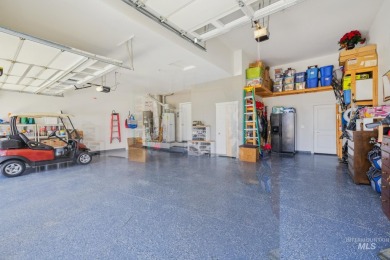 This stunning, custom-built home features both a primary and on Hunters Point Golf Club in Idaho - for sale on GolfHomes.com, golf home, golf lot