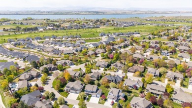 This stunning, custom-built home features both a primary and on Hunters Point Golf Club in Idaho - for sale on GolfHomes.com, golf home, golf lot