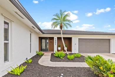 Step inside this beautifully updated coastal retreat and on Saint Andrews South Golf Club in Florida - for sale on GolfHomes.com, golf home, golf lot