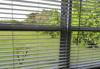 BEAUTIFUL, VERY SPACIOUS CORNER UNIT OFFERING ABUNDANT NATURAL on Sunrise Lakes Phase III in Florida - for sale on GolfHomes.com, golf home, golf lot