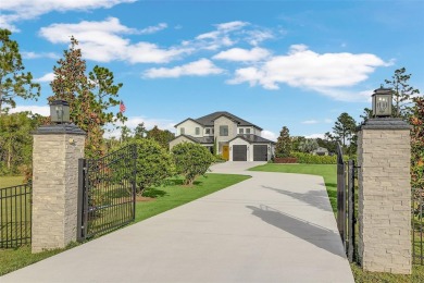 This exquisite 6 bedroom, 4.5 bath modern farmhouse sits on on Wedgefield Golf Club in Florida - for sale on GolfHomes.com, golf home, golf lot