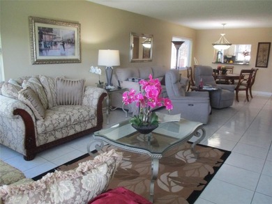 BEAUTIFUL, VERY SPACIOUS CORNER UNIT OFFERING ABUNDANT NATURAL on Sunrise Lakes Phase III in Florida - for sale on GolfHomes.com, golf home, golf lot