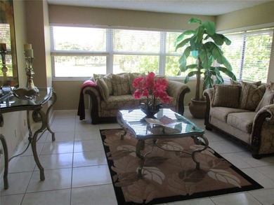 BEAUTIFUL, VERY SPACIOUS CORNER UNIT OFFERING ABUNDANT NATURAL on Sunrise Lakes Phase III in Florida - for sale on GolfHomes.com, golf home, golf lot