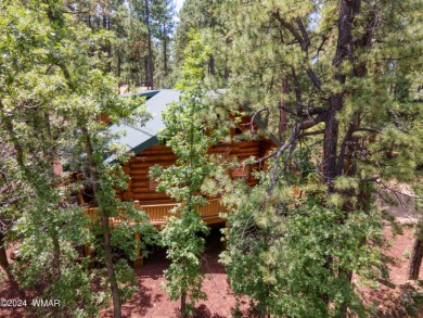 Custom FULL LOG cabin ON TWO LOTS . This Pinetop Lakes Country on Pinetop Lakes Golf and Country Club in Arizona - for sale on GolfHomes.com, golf home, golf lot