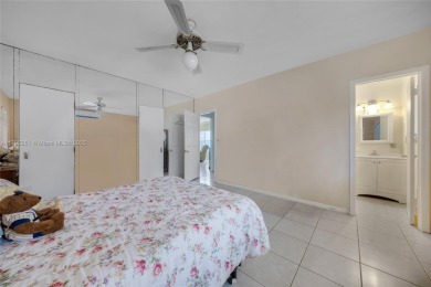 Located in the guard-gated community of Normandy Shores, this on Normandy Shores Golf Course in Florida - for sale on GolfHomes.com, golf home, golf lot