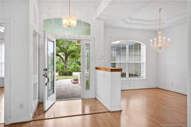 Step inside and fall in love with the view - a sparkling pool on Eagle Marsh Golf Club in Florida - for sale on GolfHomes.com, golf home, golf lot