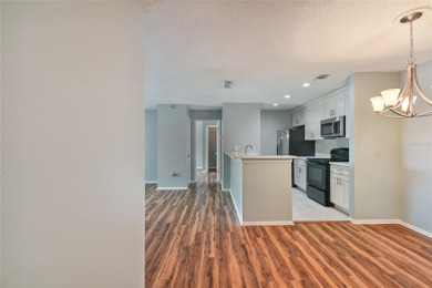 Spacious END UNIT with 3 bedrooms and 2 full bathrooms WITH A on Hunters Green Country Club in Florida - for sale on GolfHomes.com, golf home, golf lot