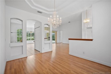 Step inside and fall in love with the view - a sparkling pool on Eagle Marsh Golf Club in Florida - for sale on GolfHomes.com, golf home, golf lot