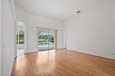 Step inside and fall in love with the view - a sparkling pool on Eagle Marsh Golf Club in Florida - for sale on GolfHomes.com, golf home, golf lot