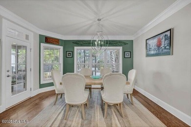 Experience luxury in this exquisite 3-bedroom, 3-bath all-brick on Cape Fear National At Brunswick Forest in North Carolina - for sale on GolfHomes.com, golf home, golf lot