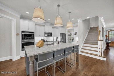 Experience luxury in this exquisite 3-bedroom, 3-bath all-brick on Cape Fear National At Brunswick Forest in North Carolina - for sale on GolfHomes.com, golf home, golf lot