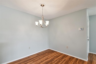 Spacious END UNIT with 3 bedrooms and 2 full bathrooms WITH A on Hunters Green Country Club in Florida - for sale on GolfHomes.com, golf home, golf lot