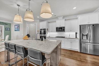 Experience luxury in this exquisite 3-bedroom, 3-bath all-brick on Cape Fear National At Brunswick Forest in North Carolina - for sale on GolfHomes.com, golf home, golf lot