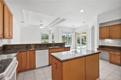 Step inside and fall in love with the view - a sparkling pool on Eagle Marsh Golf Club in Florida - for sale on GolfHomes.com, golf home, golf lot
