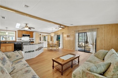 LAND OWNED-NO LAND LEASE! Welcome to 2629 Caper Court in the on Spanish Lakes Golf Village in Florida - for sale on GolfHomes.com, golf home, golf lot