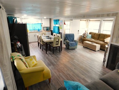 This inviting single-wide home in Betmar Acres, a friendly 55+ on Betmar Acres Golf Club in Florida - for sale on GolfHomes.com, golf home, golf lot