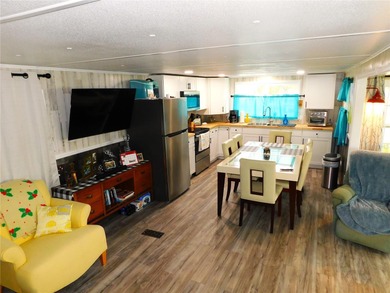 This inviting single-wide home in Betmar Acres, a friendly 55+ on Betmar Acres Golf Club in Florida - for sale on GolfHomes.com, golf home, golf lot