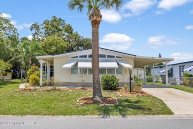 Beautiful updated manufactured home in Barefoot Bay. New roof in on Barefoot Bay Golf Course in Florida - for sale on GolfHomes.com, golf home, golf lot