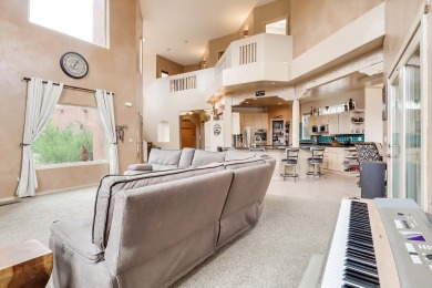 This custom Leo Husky home is a beautiful combination of nature on Paa-Ko Ridge Golf Club  in New Mexico - for sale on GolfHomes.com, golf home, golf lot