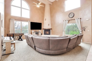 This custom Leo Husky home is a beautiful combination of nature on Paa-Ko Ridge Golf Club  in New Mexico - for sale on GolfHomes.com, golf home, golf lot