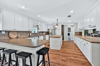 1246 Kiowa Drive West sits on a spacious double lot in the gated on Lake Kiowa Golf Course in Texas - for sale on GolfHomes.com, golf home, golf lot