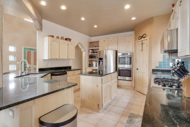 This custom Leo Husky home is a beautiful combination of nature on Paa-Ko Ridge Golf Club  in New Mexico - for sale on GolfHomes.com, golf home, golf lot