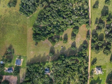 Tucked away just outside of New Ulm, this beautiful 8.703-acre on The Falls Resort and Club in Texas - for sale on GolfHomes.com, golf home, golf lot