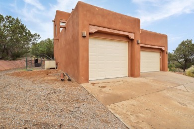 This custom Leo Husky home is a beautiful combination of nature on Paa-Ko Ridge Golf Club  in New Mexico - for sale on GolfHomes.com, golf home, golf lot