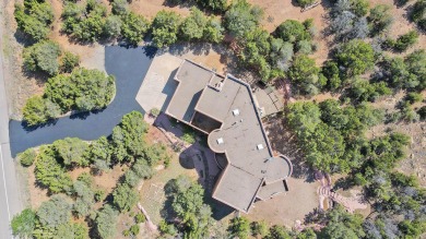 This custom Leo Husky home is a beautiful combination of nature on Paa-Ko Ridge Golf Club  in New Mexico - for sale on GolfHomes.com, golf home, golf lot