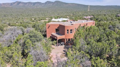 This custom Leo Husky home is a beautiful combination of nature on Paa-Ko Ridge Golf Club  in New Mexico - for sale on GolfHomes.com, golf home, golf lot