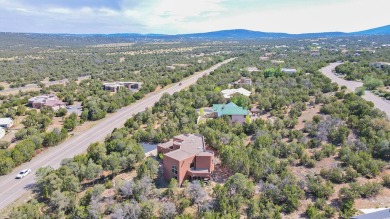 This custom Leo Husky home is a beautiful combination of nature on Paa-Ko Ridge Golf Club  in New Mexico - for sale on GolfHomes.com, golf home, golf lot