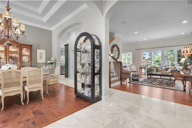 Enjoy tranquil lagoon views and a front-row seat to the 8th on Wexford Golf Club in South Carolina - for sale on GolfHomes.com, golf home, golf lot