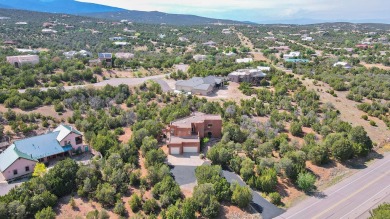 This custom Leo Husky home is a beautiful combination of nature on Paa-Ko Ridge Golf Club  in New Mexico - for sale on GolfHomes.com, golf home, golf lot