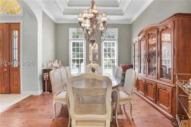 Enjoy tranquil lagoon views and a front-row seat to the 8th on Wexford Golf Club in South Carolina - for sale on GolfHomes.com, golf home, golf lot
