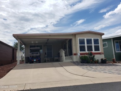 This PERFECTLY located 2 bed 2 bath home Across from the Fairway on Juniper Ridge R.V. Golf Resort in Arizona - for sale on GolfHomes.com, golf home, golf lot