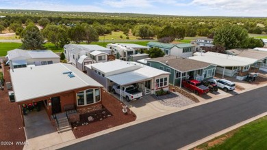 This PERFECTLY located 2 bed 2 bath home Across from the Fairway on Juniper Ridge R.V. Golf Resort in Arizona - for sale on GolfHomes.com, golf home, golf lot