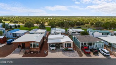 This PERFECTLY located 2 bed 2 bath home Across from the Fairway on Juniper Ridge R.V. Golf Resort in Arizona - for sale on GolfHomes.com, golf home, golf lot