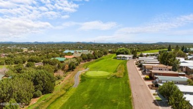 This PERFECTLY located 2 bed 2 bath home Across from the Fairway on Juniper Ridge R.V. Golf Resort in Arizona - for sale on GolfHomes.com, golf home, golf lot