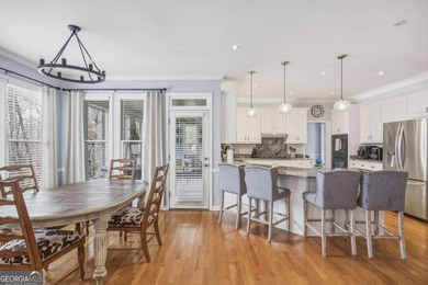 Welcome to this 5-bedroom home that sits on a corner lot and on Towne Lake Hills Golf Club in Georgia - for sale on GolfHomes.com, golf home, golf lot