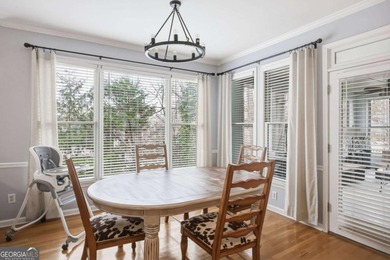 Welcome to this 5-bedroom home that sits on a corner lot and on Towne Lake Hills Golf Club in Georgia - for sale on GolfHomes.com, golf home, golf lot