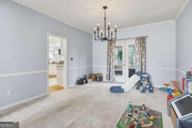 Welcome to this 5-bedroom home that sits on a corner lot and on Towne Lake Hills Golf Club in Georgia - for sale on GolfHomes.com, golf home, golf lot