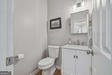 Welcome to this 5-bedroom home that sits on a corner lot and on Towne Lake Hills Golf Club in Georgia - for sale on GolfHomes.com, golf home, golf lot