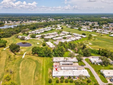 Nestled on the first hole of the Little Course golf course, this on Seven Springs Golf and Country Club in Florida - for sale on GolfHomes.com, golf home, golf lot