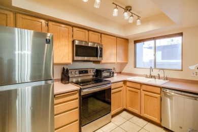 Spacious 2-story, 2 bed, 3 bath home just steps from a Yuma golf on Yuma Golf and Country Club in Arizona - for sale on GolfHomes.com, golf home, golf lot