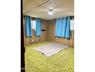 Located on parcel 181309-21003, this manufactured home is just on Suntides Golf Course in Washington - for sale on GolfHomes.com, golf home, golf lot