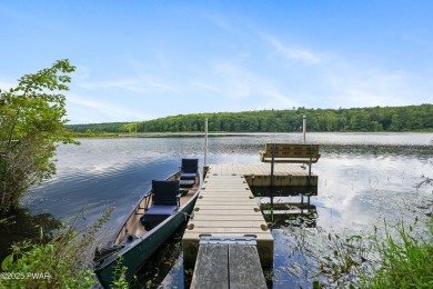 Meticulously maintained log-sided lakefront on TinkWig Lake with on Woodloch Springs Country Club in Pennsylvania - for sale on GolfHomes.com, golf home, golf lot