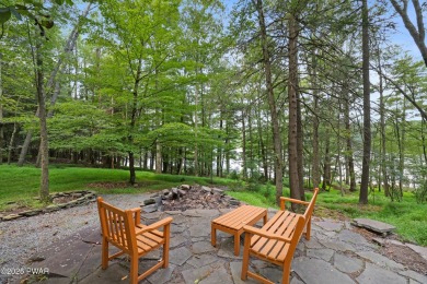 Meticulously maintained log-sided lakefront on TinkWig Lake with on Woodloch Springs Country Club in Pennsylvania - for sale on GolfHomes.com, golf home, golf lot
