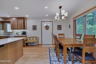 Meticulously maintained log-sided lakefront on TinkWig Lake with on Woodloch Springs Country Club in Pennsylvania - for sale on GolfHomes.com, golf home, golf lot